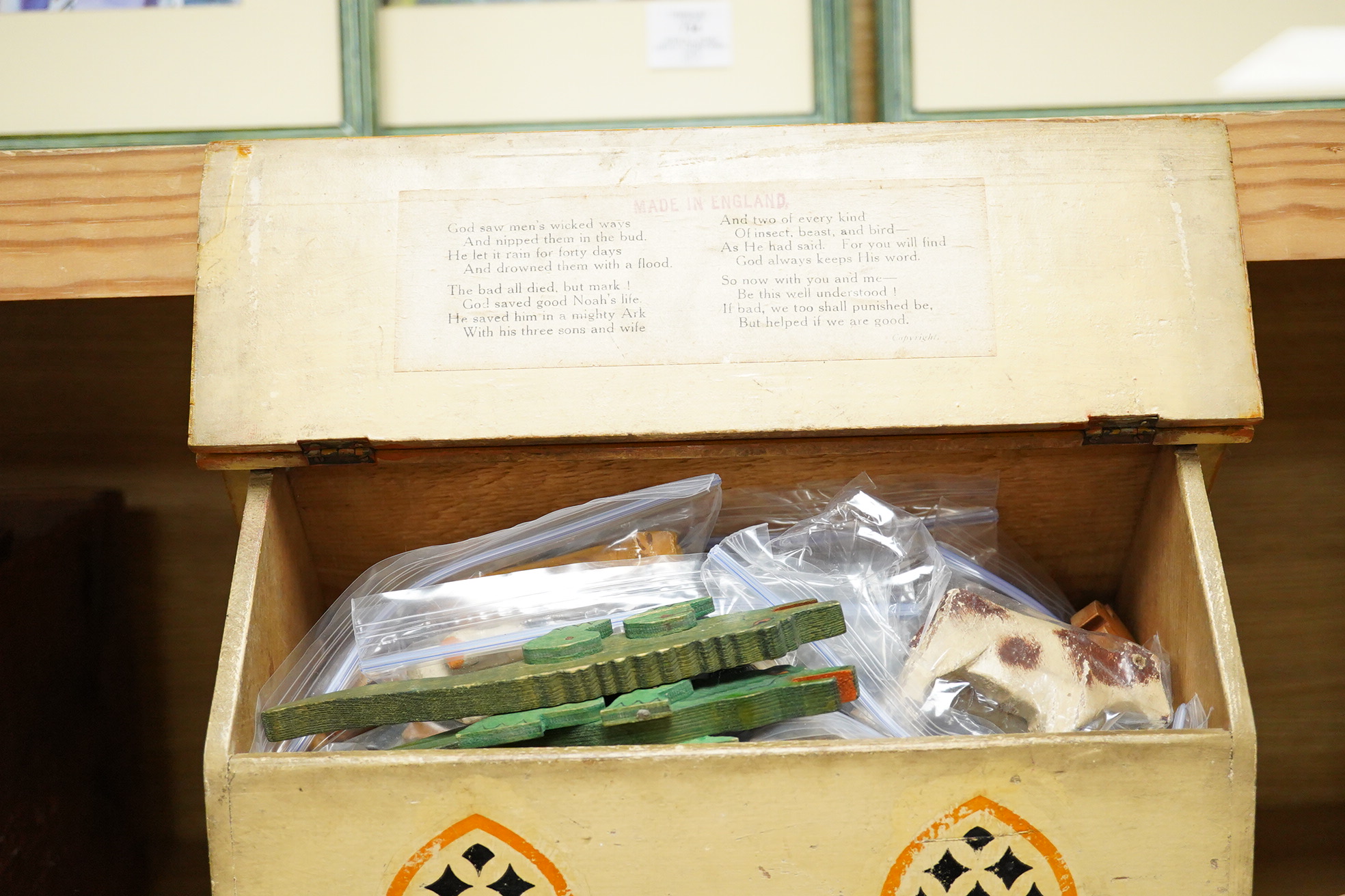 A First World War ‘War Relief Toy Work’ painted pine Noah's Ark with a quantity of carved and painted wooden animals, the ark with hinged lid, label pasted to the inside of the lid stating; Made in England, with a biblic